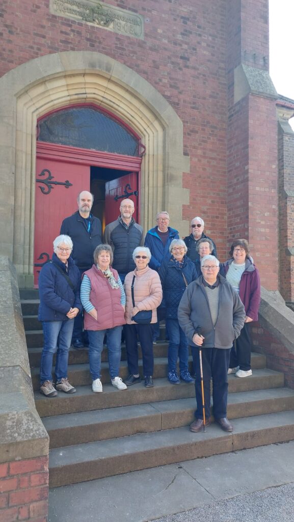 u3a members standing on steps at the pumping station